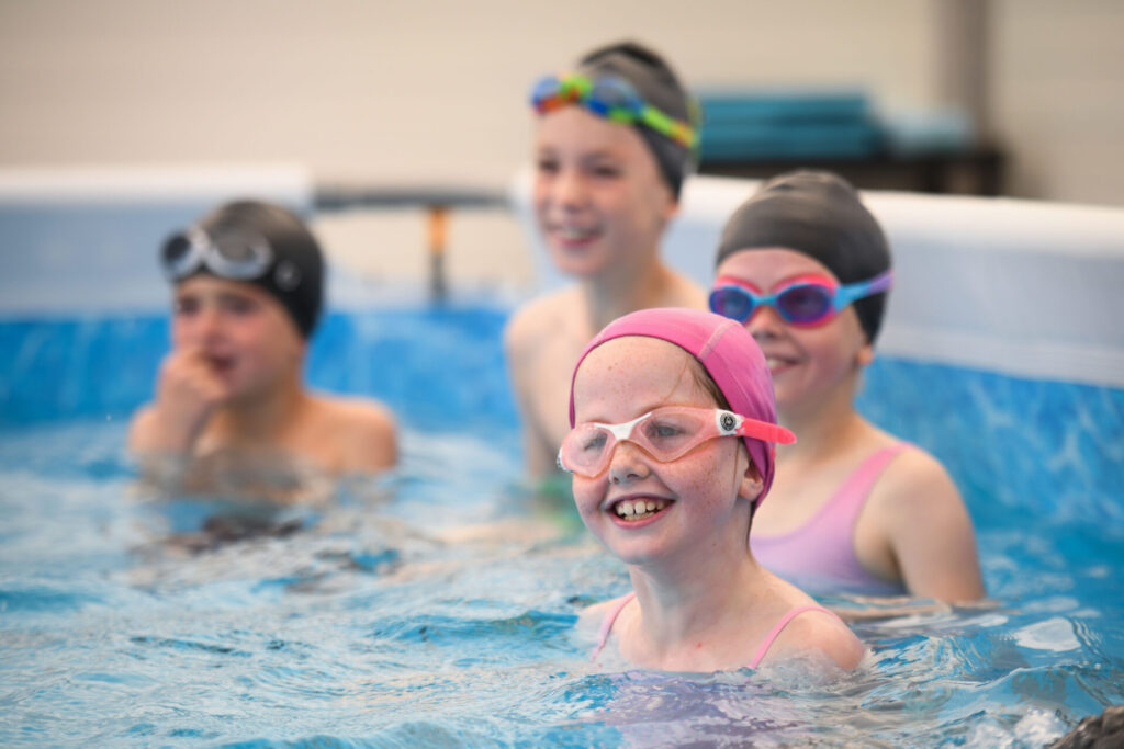group of children in pop-up pool